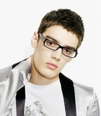 He has short black straight hair and he wears glasses. 